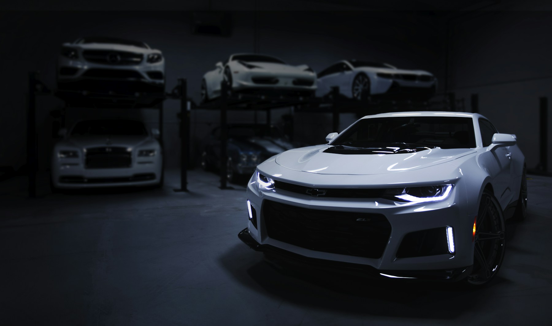Illustrative automotive photograph of a polished dark sports car